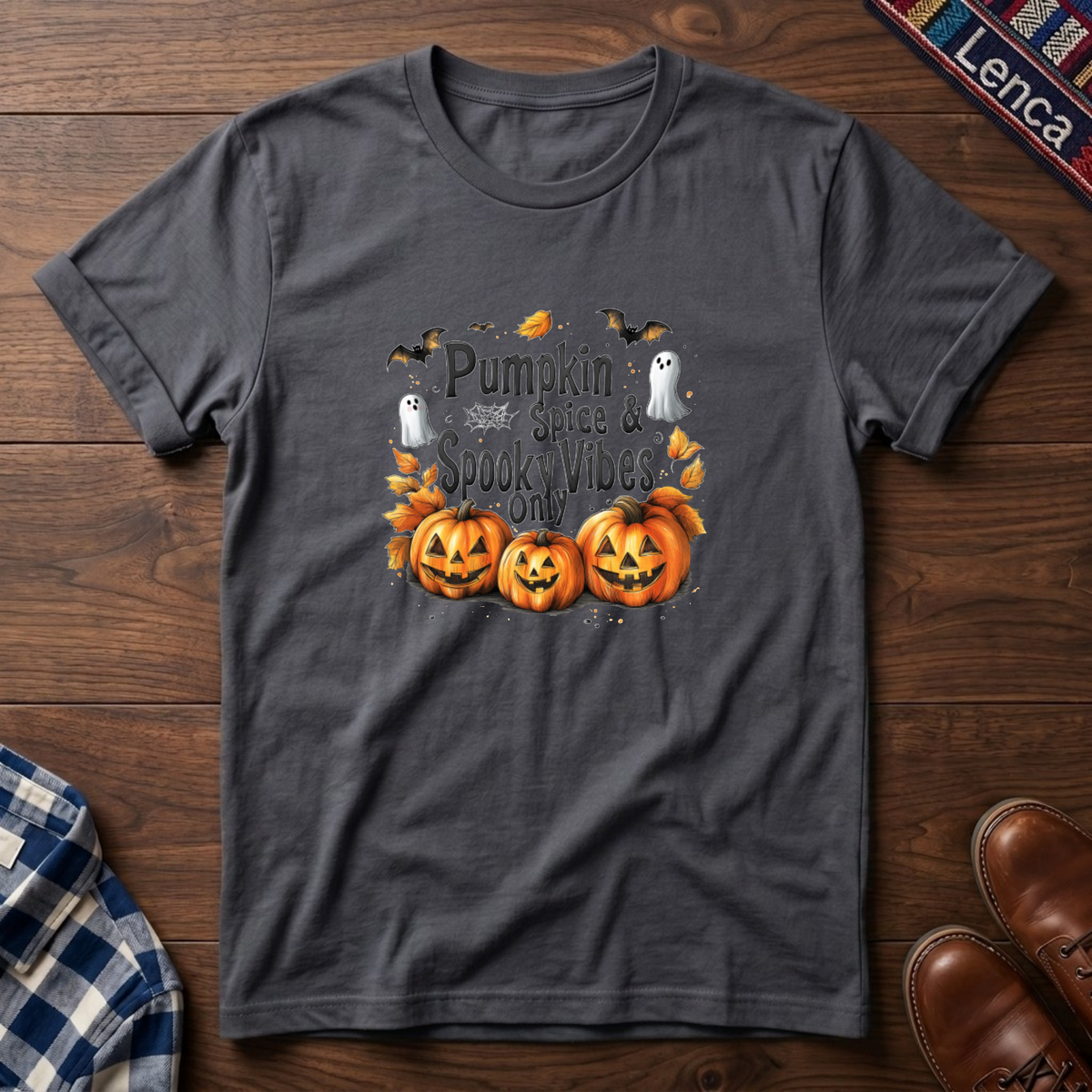 A charcoal short-sleeve t-shirt with a Halloween graphic print featuring three orange jack-o'-lanterns, white ghosts, and the text 'Pumpkin Spice is Spooktacular'.