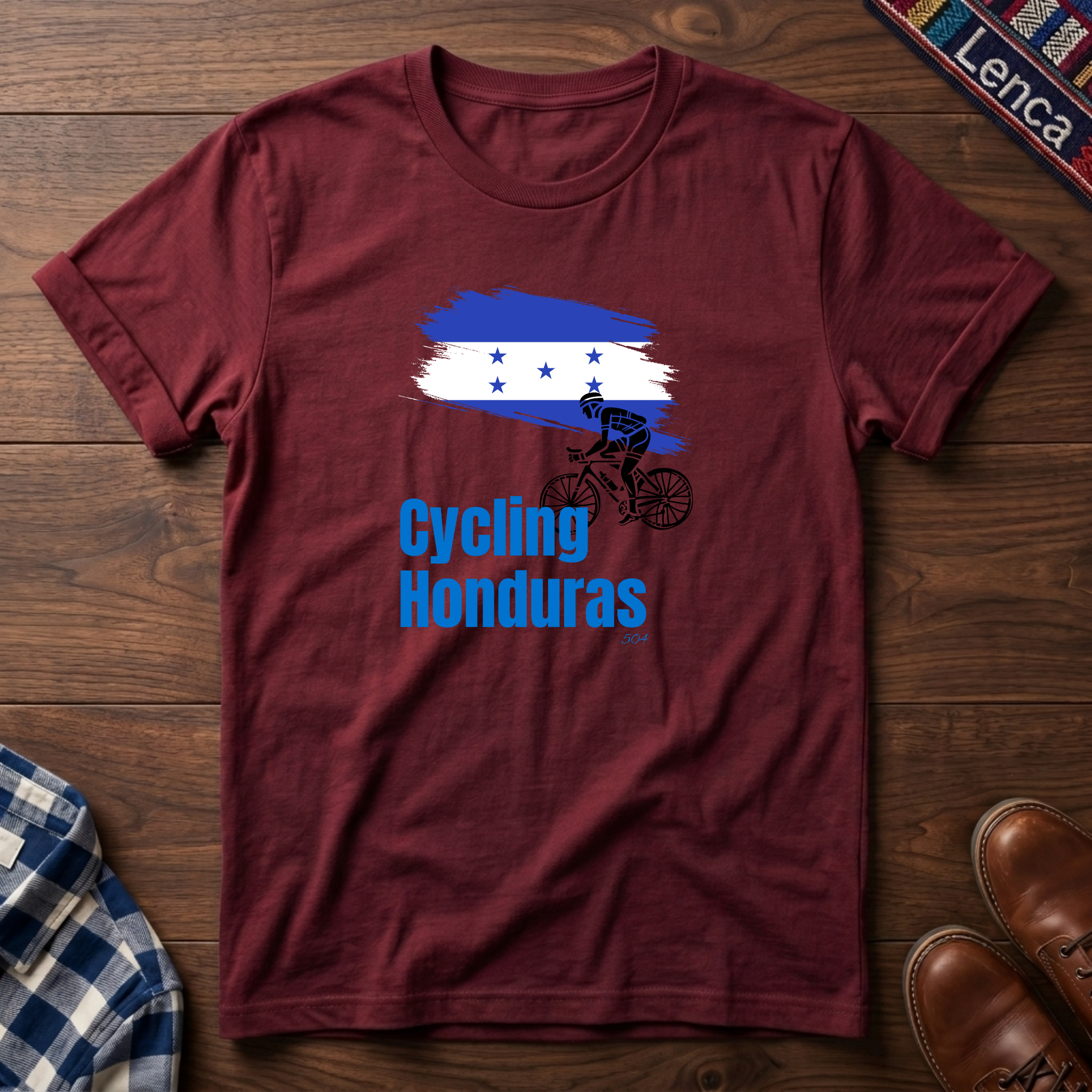 Cherry red t-shirt with 'Cycling Honduras' text design on a white background