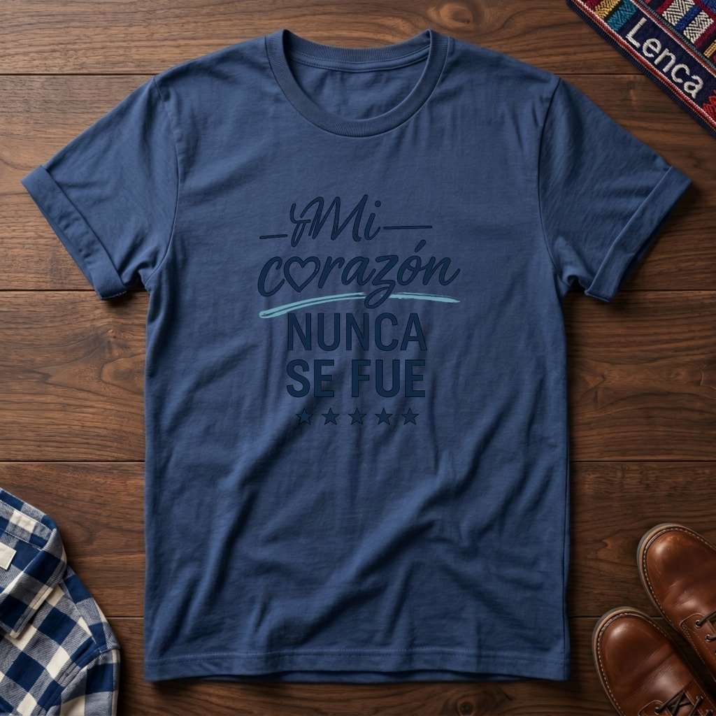 Heather Indigo t-shirt with 'Mi Corazon Nunca' text on a wooden surface.