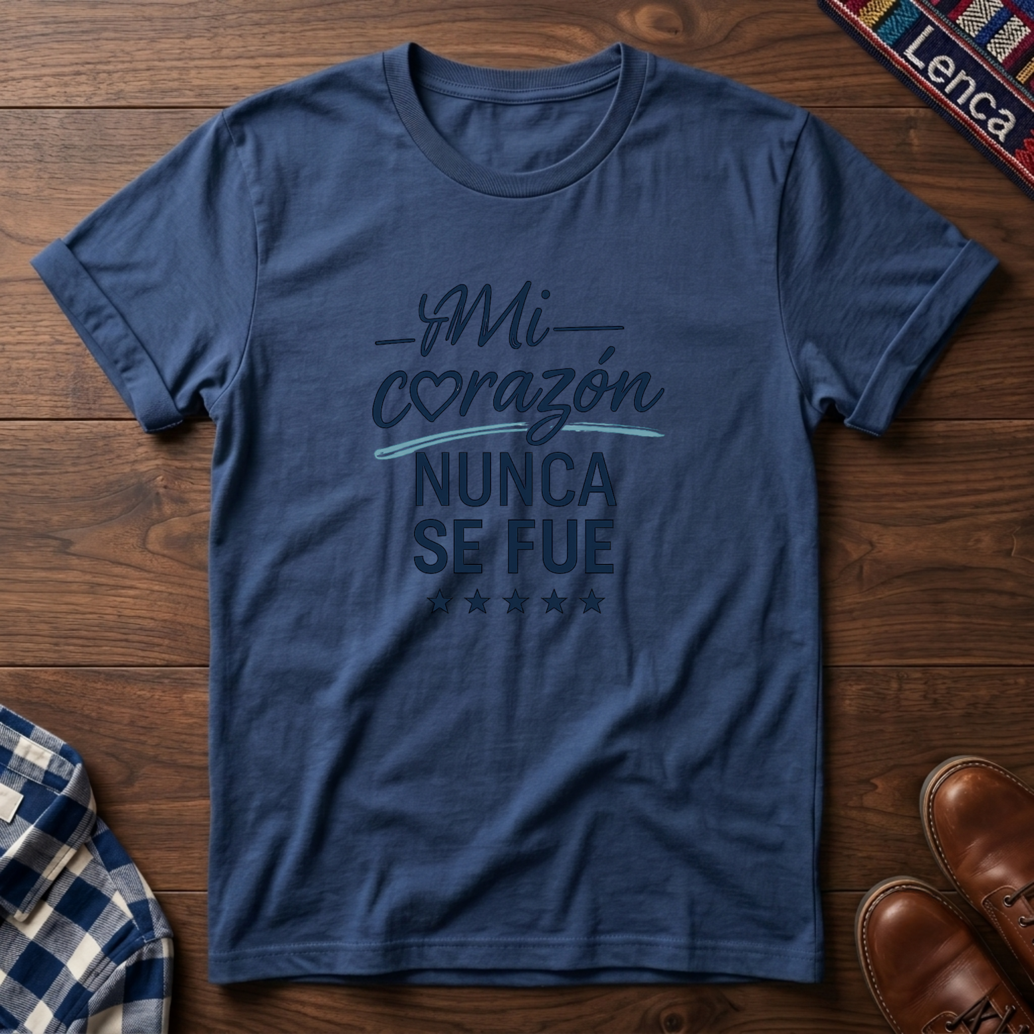 Heather Indigo t-shirt with 'Mi Corazon Nunca' text on a wooden surface.