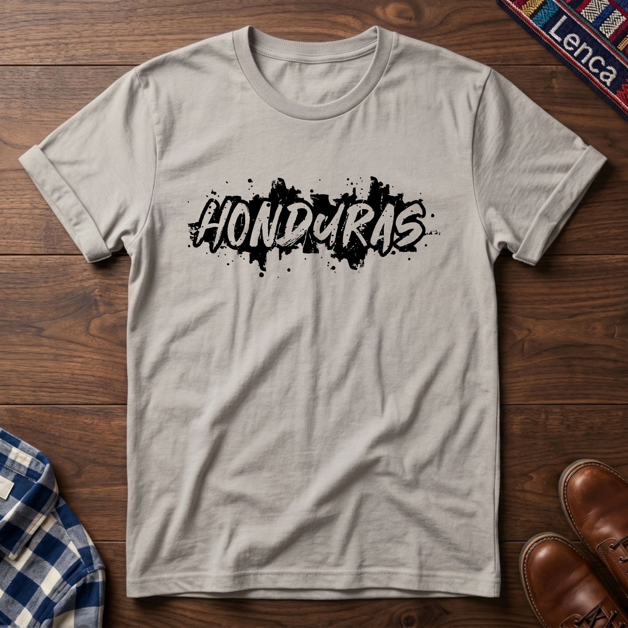 Ice gray t-shirt with 'Honduras' print on a wooden surface
