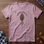 Light Pink t-shirt with 'Honduras' text and leaf graphic on a wooden surface.