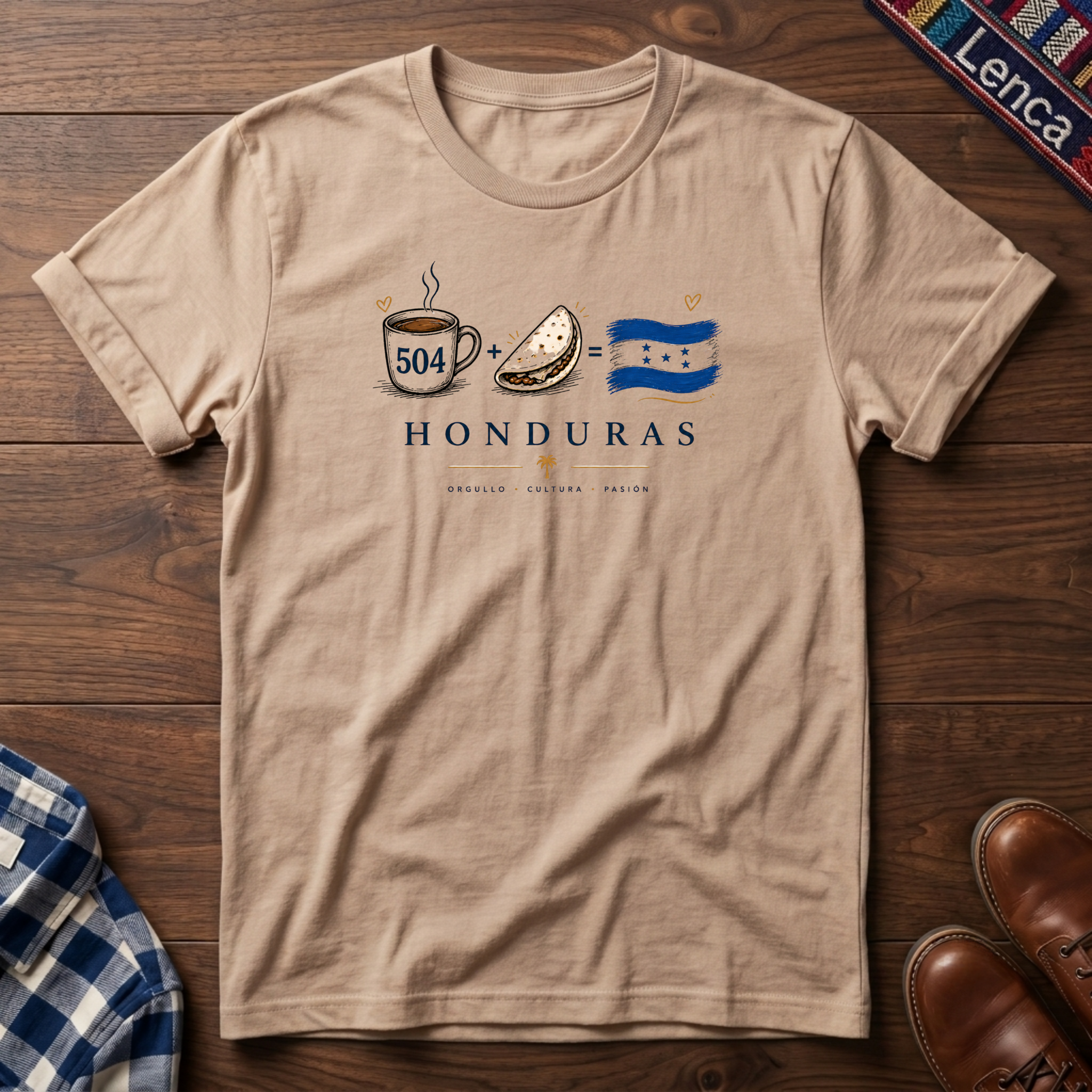 Natural t-shirt with 'Honduras' text and a Cafe Baleada Bandera graphic design on a wooden surface.