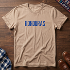 A natural crewneck t-shirt with 'HONDURAS' printed in blue block letters across the chest.