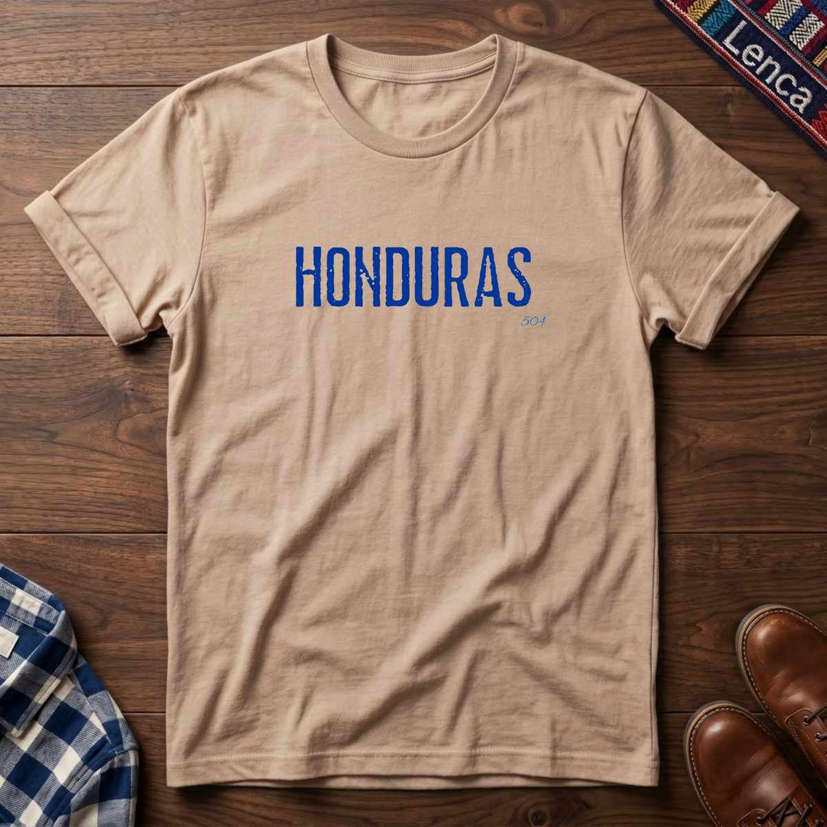 A natural crewneck t-shirt with 'HONDURAS' printed in blue block letters across the chest.