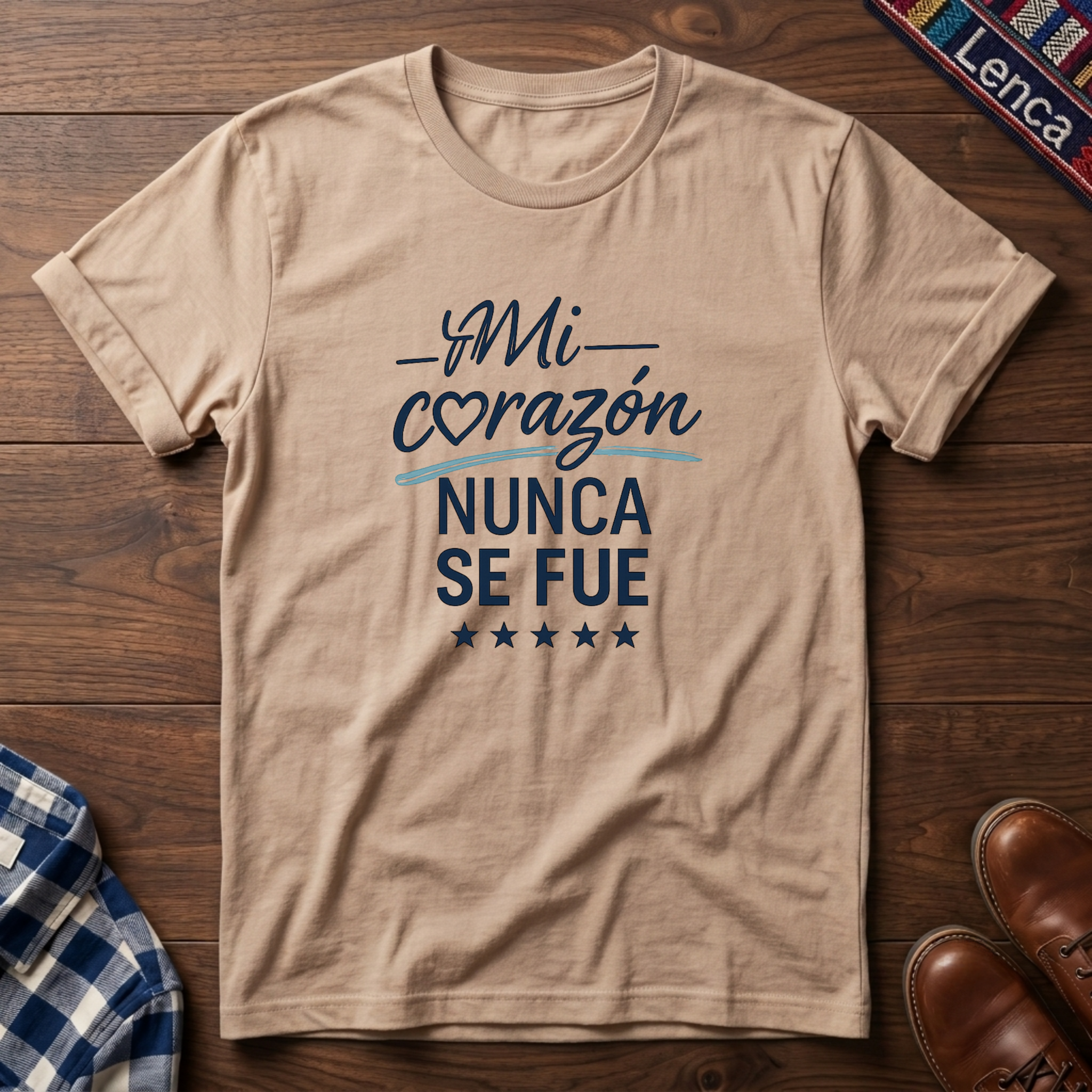 Natural t-shirt with 'Mi Corazon Nunca' text on a wooden surface.