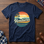 Navy blue t-shirt with 'Honduras' text graphic design on a wooden surface