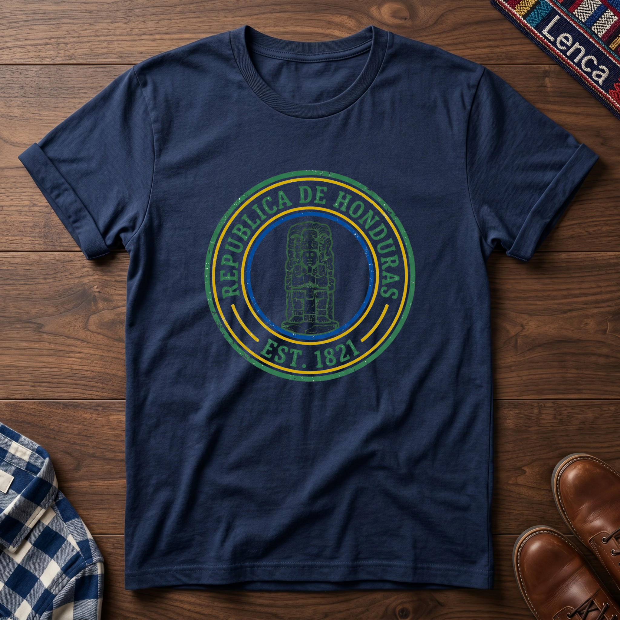 Navy blue t-shirt with 'Republica de Honduras' text graphic design on a wooden surface