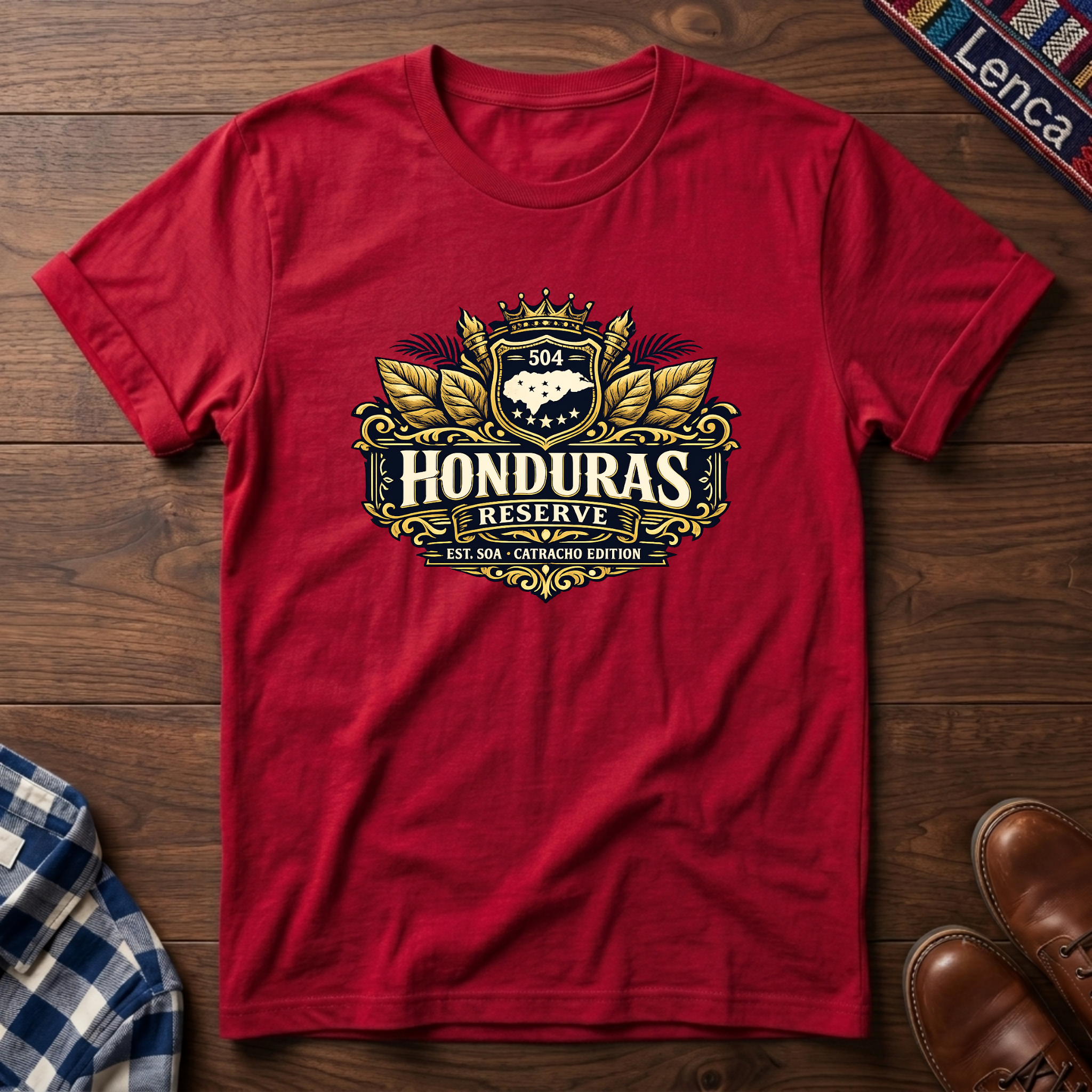Red t-shirt with a 'Honduras Reserve' graphic design on a wooden surface