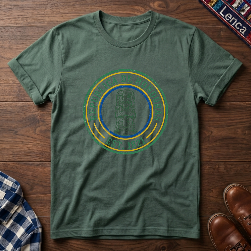 Sage t-shirt with 'Republica de Honduras' text graphic design on a wooden surface