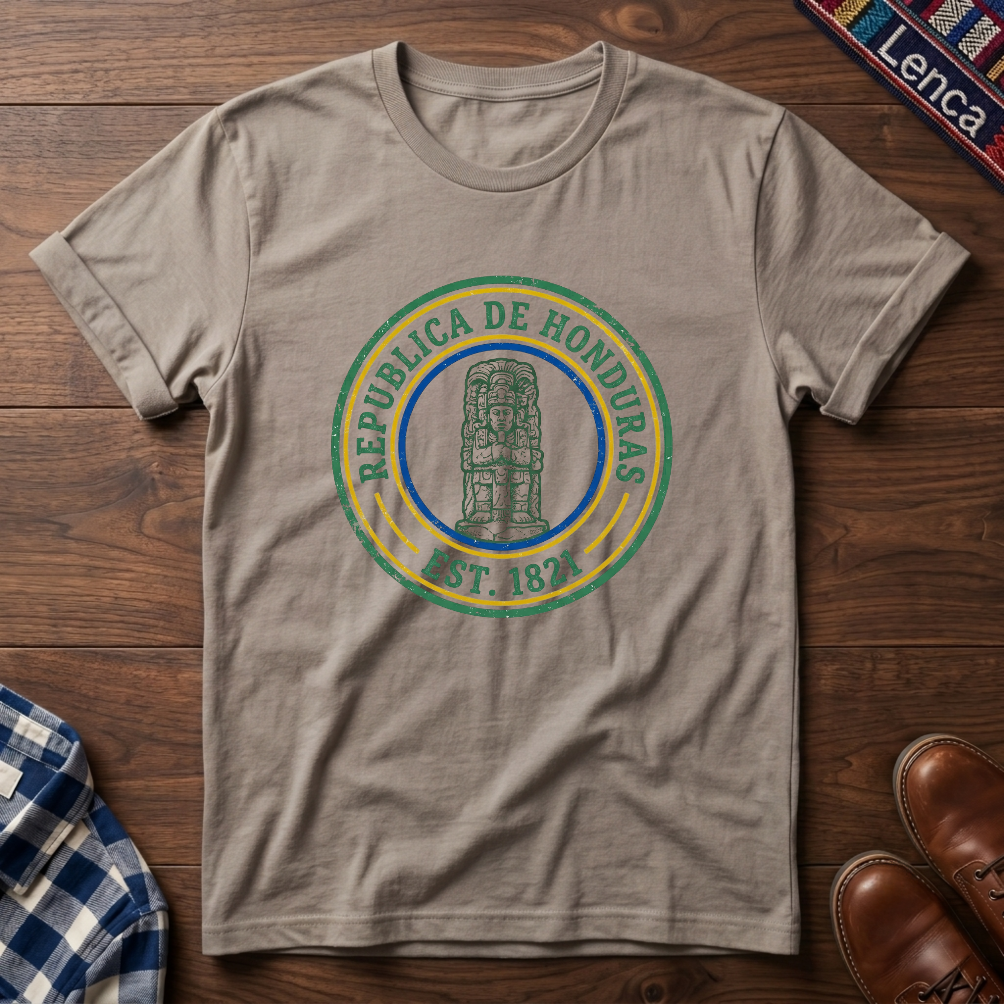 Sand t-shirt with 'Republica de Honduras' text graphic design on a wooden surface