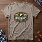 Sand t-shirt with a 'Honduras Reserve' graphic design on a wooden surface.