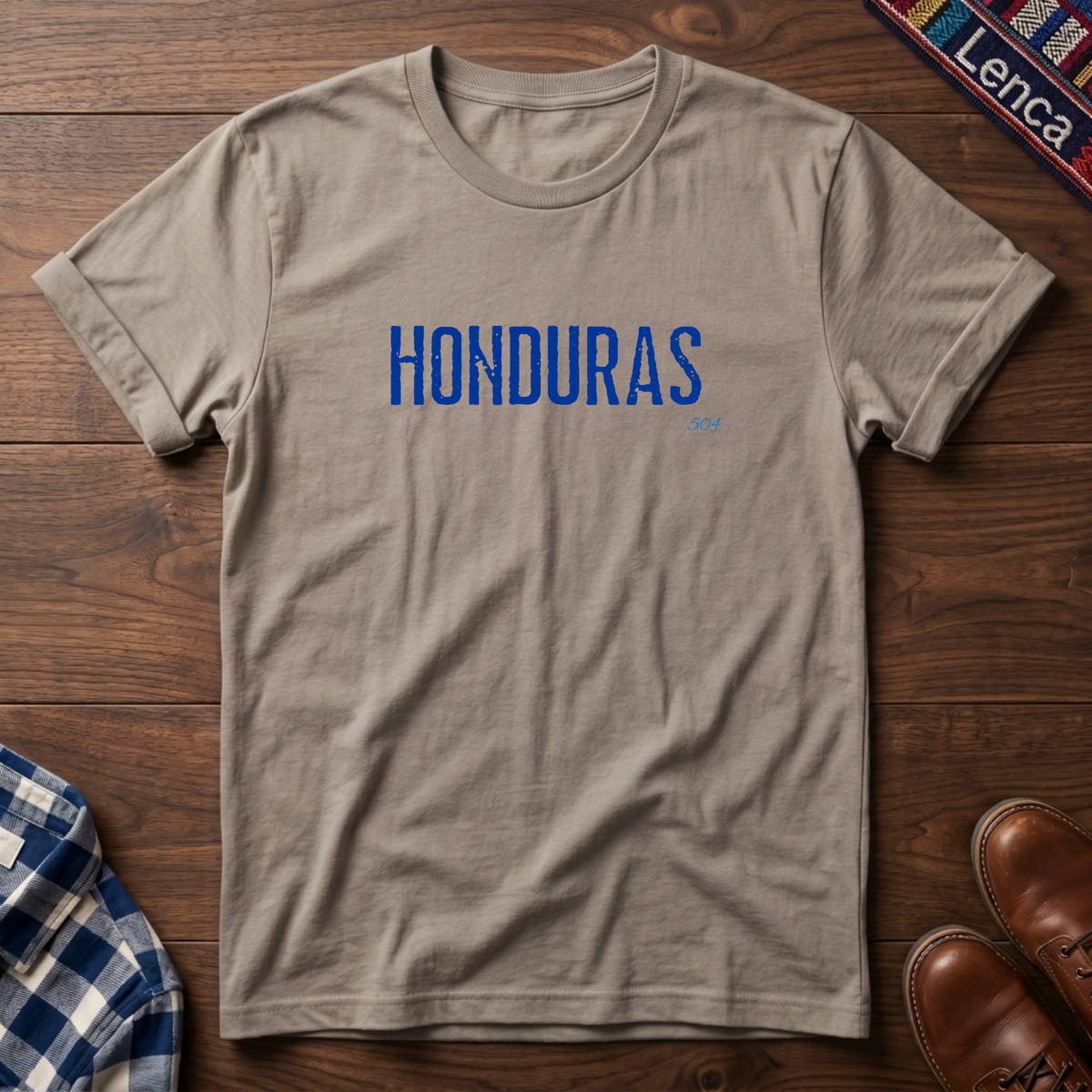 A sand crewneck t-shirt with 'HONDURAS' printed in blue block letters across the chest.