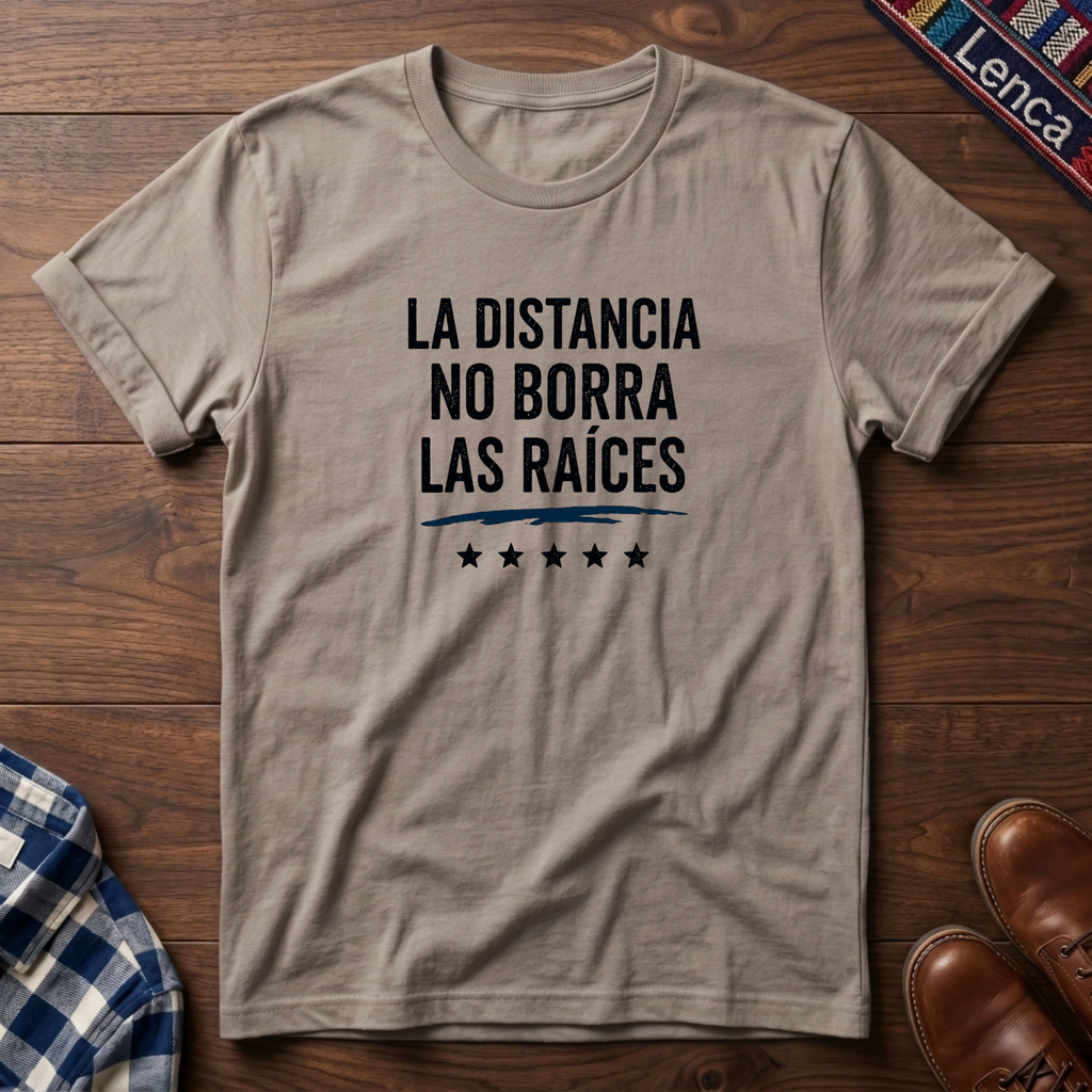 Sand t-shirt with 'La Distancia' text on a wooden surface.