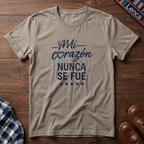 Sand t-shirt with 'Mi Corazon Nunca' text on a wooden surface.