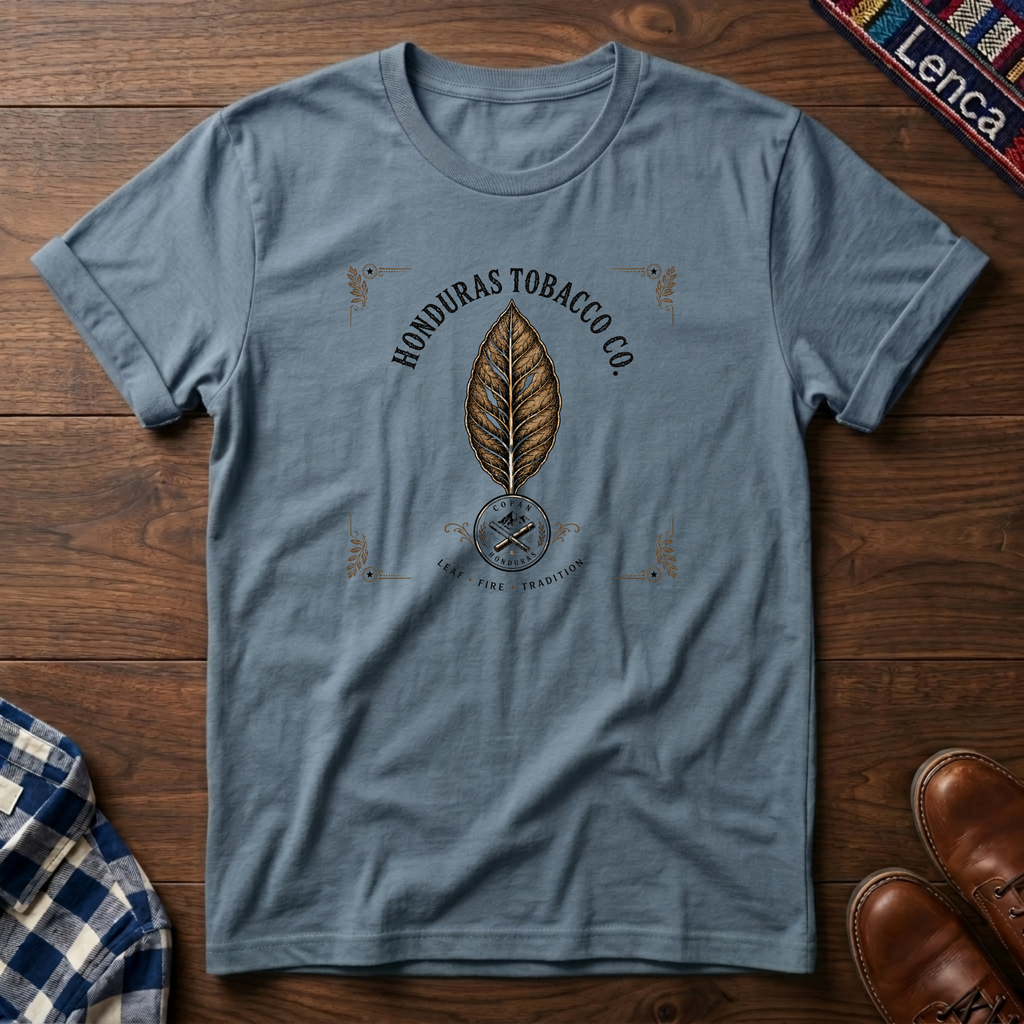 Stone blue t-shirt with 'Honduras' text and leaf graphic on a wooden surface