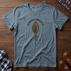 Stone blue t-shirt with 'Honduras' text and leaf graphic on a wooden surface