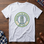 White t-shirt with 'Republica de Honduras' text graphic design on a wooden surface