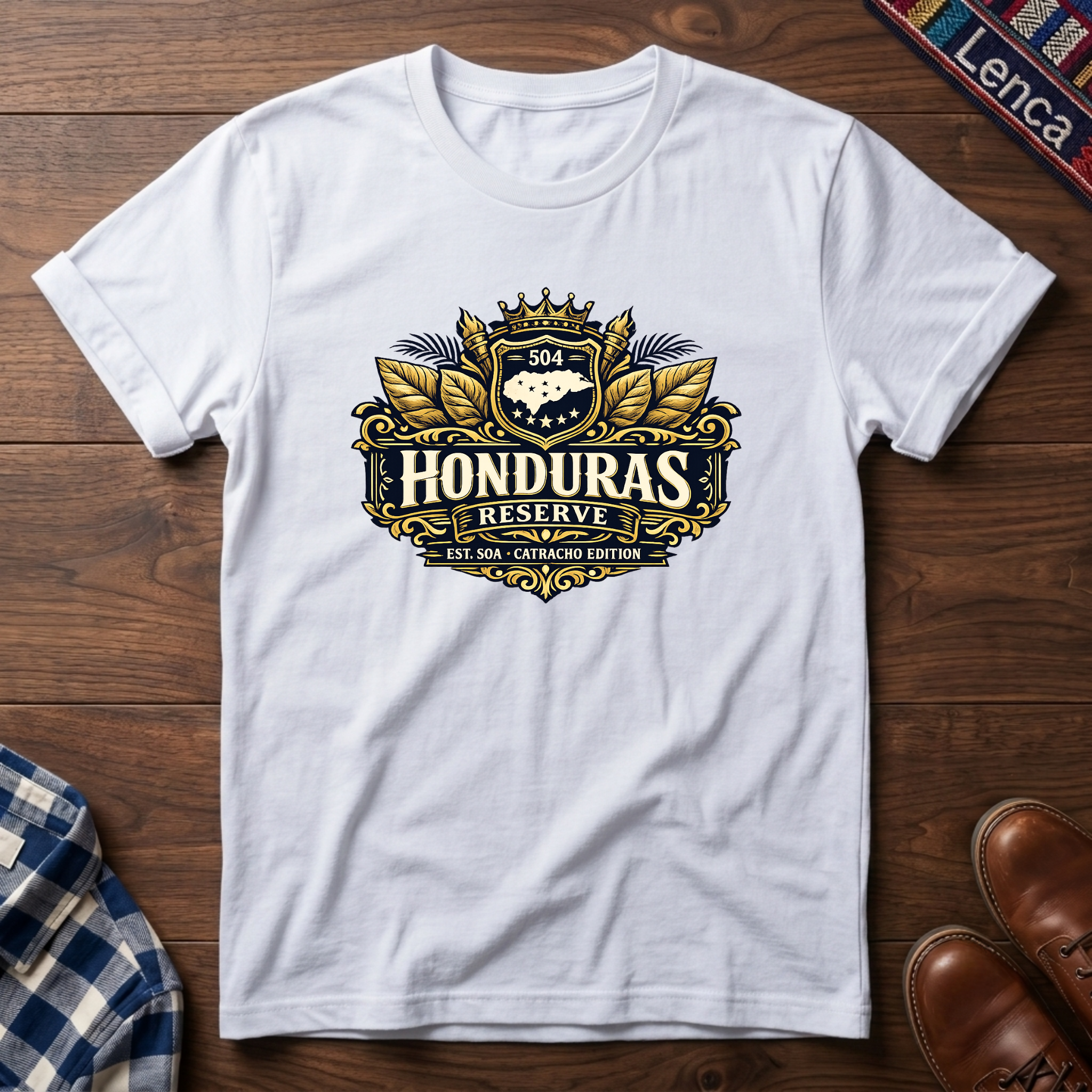 White t-shirt with a 'Honduras Reserve' graphic design on a wooden surface.