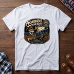 White t-shirt with 'Honduras Cigar Blues' graphic on a wooden surface.